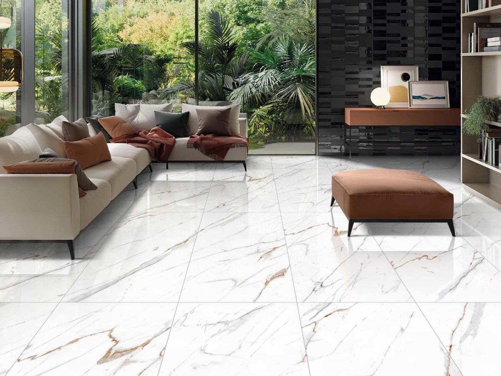 A living room floored and walled in Lumara Statuario marble-effect porcelain